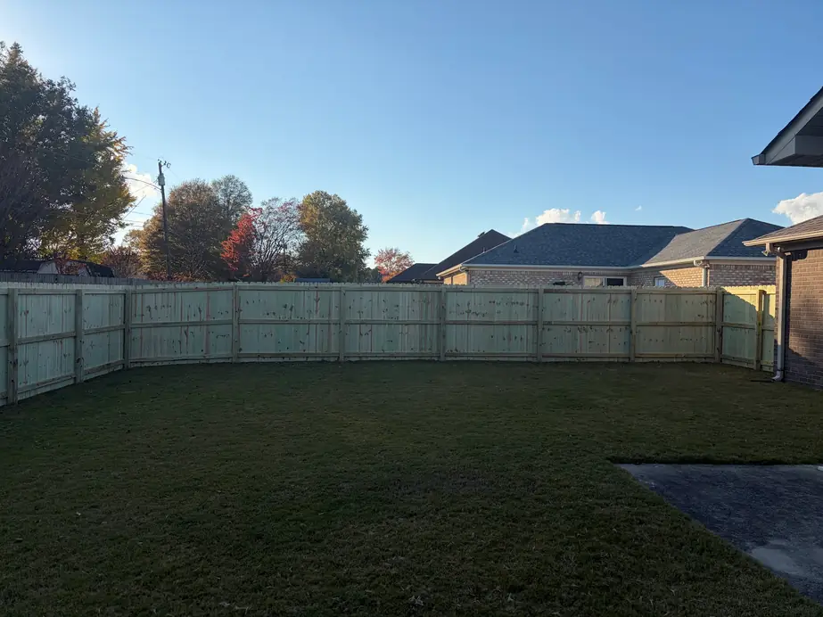 Wood privacy fence enclosing the full back yard of a new build home in North Alabama